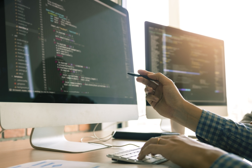 a woman writing html code